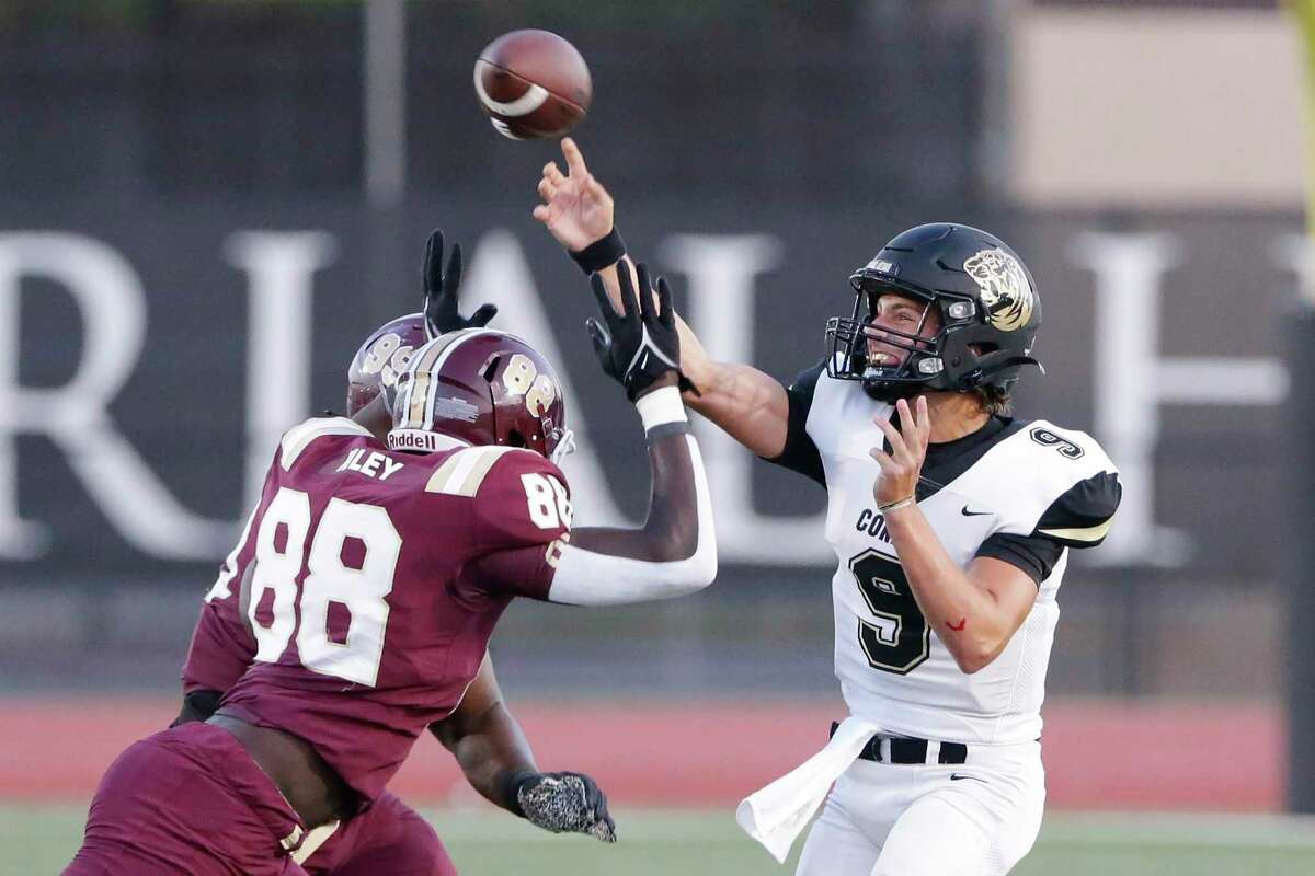 Conroe quarterback Clayton Garlock (9) passes the ball under pressure from Summer Creek’s Karmari Weatherspoon (99) and Raj Kotak (88) during the first half of their non-district high school football game at George Turner Stadium Friday, Sept. 10, 2021 in Humble, TX.