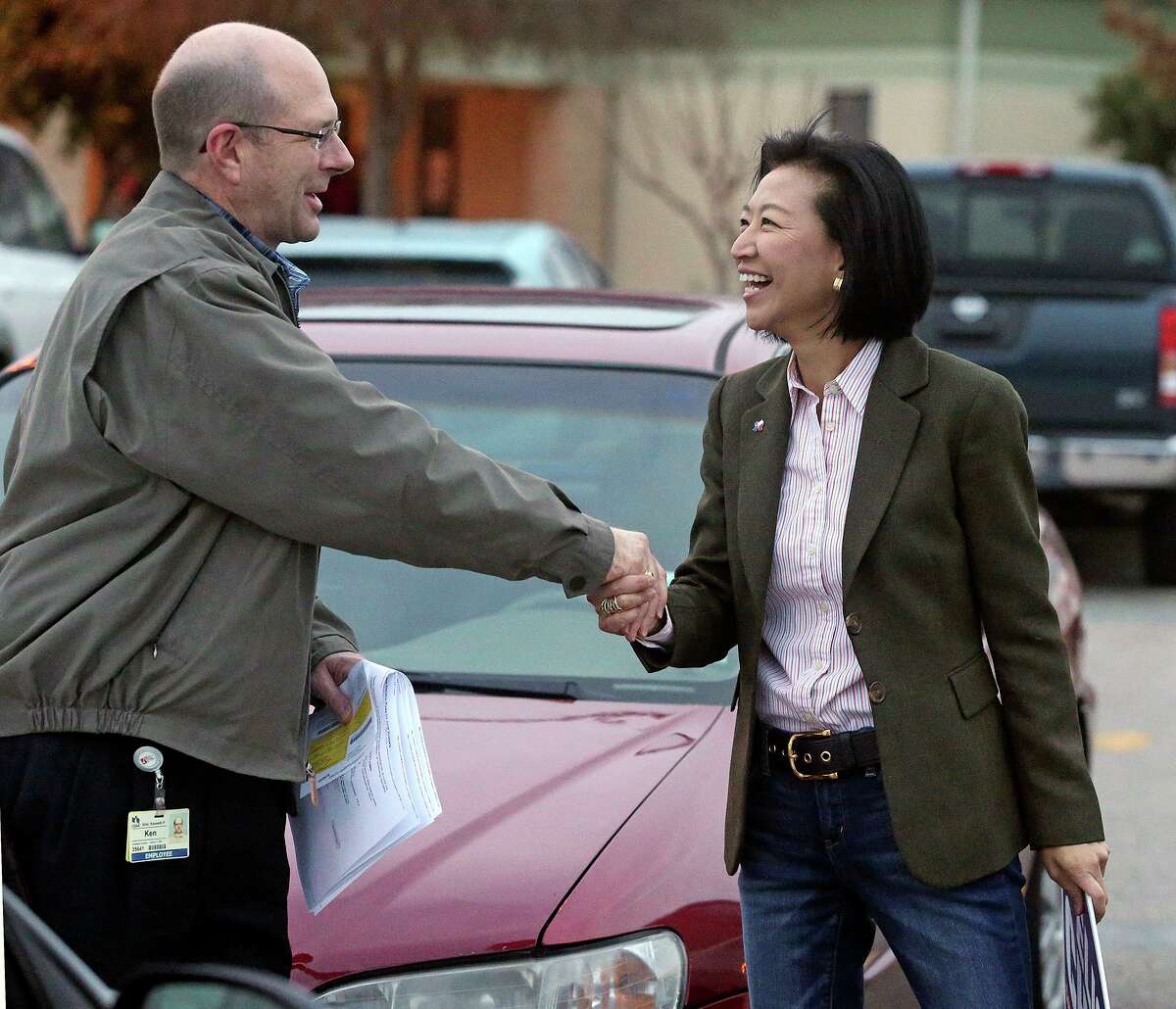 Elisa Chan thanks voter Ken Ebel at Barbara Bush Elementary School as she continues to work during voting on March 4, 2014, her last campaign. Chan said she is definitely running for District 122 if state Rep. Lyle Larson, as expected, steps aside.