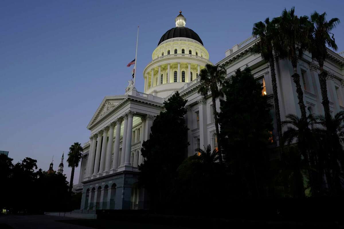 The lights of the Capitol dome shine as lawmakers work into the night in Sacramento, Calif., Friday, Sept. 10, 2021. Lawmakers have until midnight to finish work on the 2021 legislative session.
