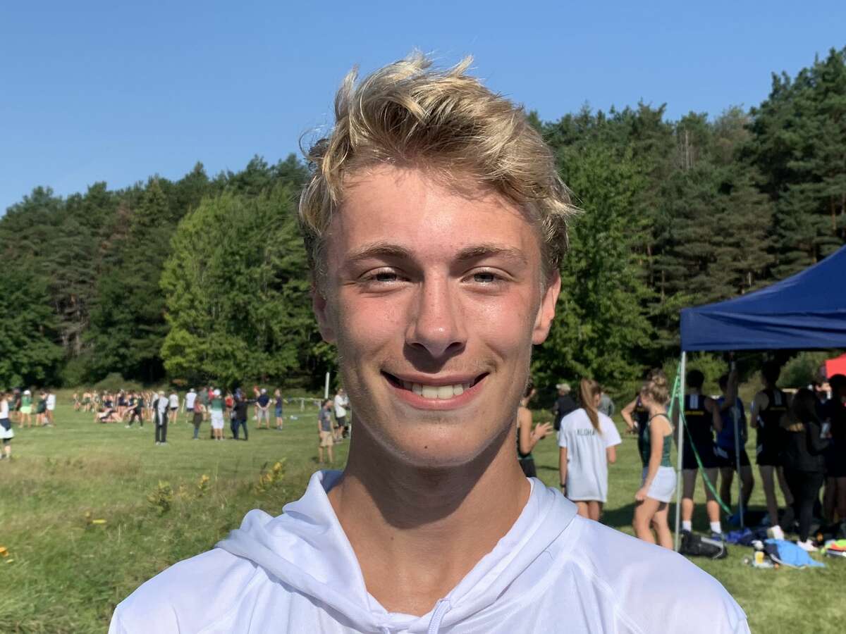 Midland High's Matthew Crowley poses after running away from the pack to win the boys' race at Saturday's Northwood Invitational cross country on the campus of Northwood University, Sept. 11, 2021.