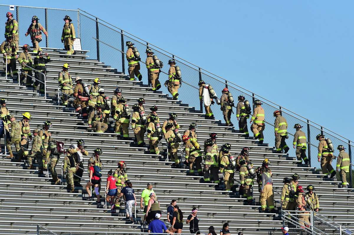 First responders climb the steps during San Antonio’s 110 9/11 Memorial Climb on Saturday morning at Heroes Stadium.