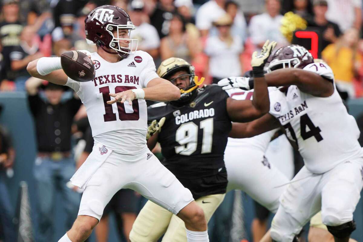 DENVER, CO - SEPTEMBER 11: Zach Calzada #10 of the Texas A&M Aggies attempts a pass against the Colorado Buffaloes during the second quarter at Empower Field At Mile High on September 11, 2021 in Denver, Colorado. (Photo by Michael Ciaglo/Getty Images)
