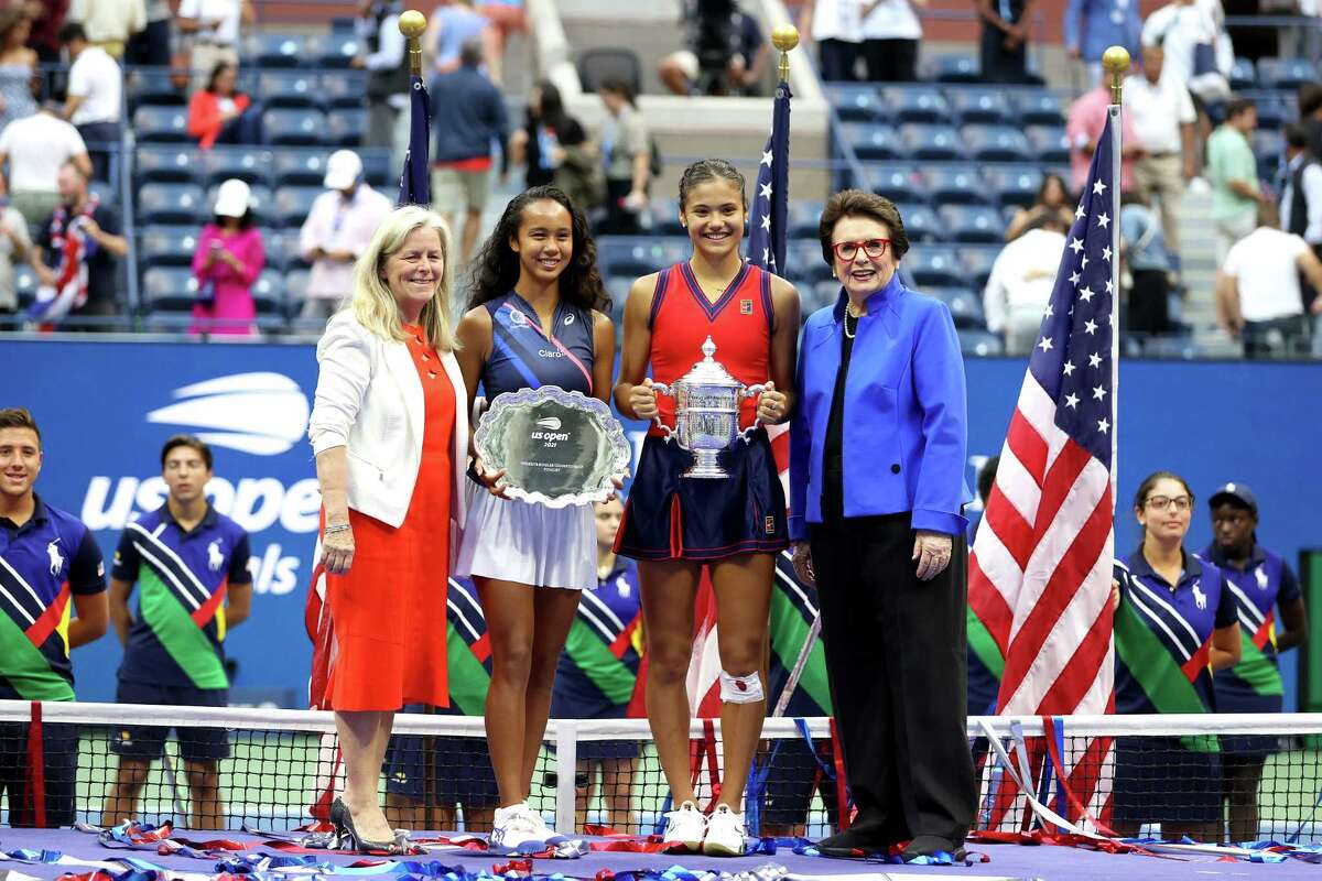 NEW YORK, NEW YORK - SEPTEMBER 11: Leylah Annie Fernandez (2nd L) of Canada holds the runner-up trophy as Emma Raducanu(2nd R) of Great Britain celebrates with the championship trophy alongside Billie Jean King (R) and Stacey Allaster (L), USTA Chief Executive, after their Women's Singles final match on Day Thirteen of the 2021 US Open at the USTA Billie Jean King National Tennis Center on September 11, 2021 in the Flushing neighborhood of the Queens borough of New York City.