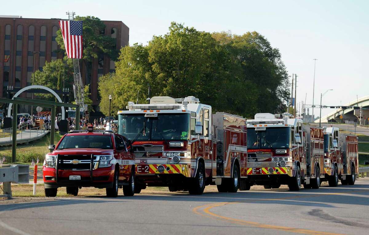 Conroe firetrucks are seen during a ceremony at the Montgomery County Veterans Memorial Park in honor of the 20th anniversary of the 9/11 terrorist attacks, Saturday, Sept. 11, 2021, in Conroe.