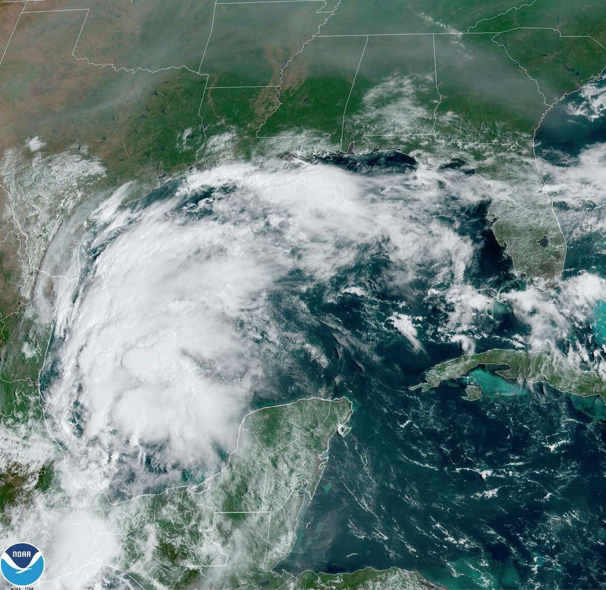 This satellite image provided by NOAA shows Tropical Storm Nicholas in the Gulf of Mexico on Sunday, Sept. 12, 2021. Tropical storm warnings have been issued for coastal Texas and the northeast coast of Mexico. Nicholas is expected to produce storm total rainfall of 5 to 10 inches, with isolated maximum amounts of 15 inches, across portions of coastal Texas into southwest Louisiana Sunday, Sept. 12 through midweek.