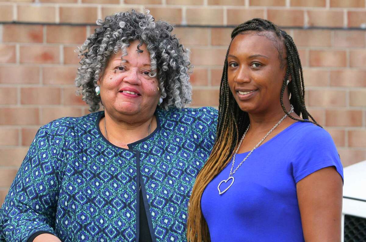 Bonnie Kim Campbell, left, and Melinda Punkin Baxter, right, Democrats running for the Board of Representatives in District 5, pose together at the Martin Luther King Jr. Apartments in Stamford, Conn., on Wednesday, Sept. 8, 2021.