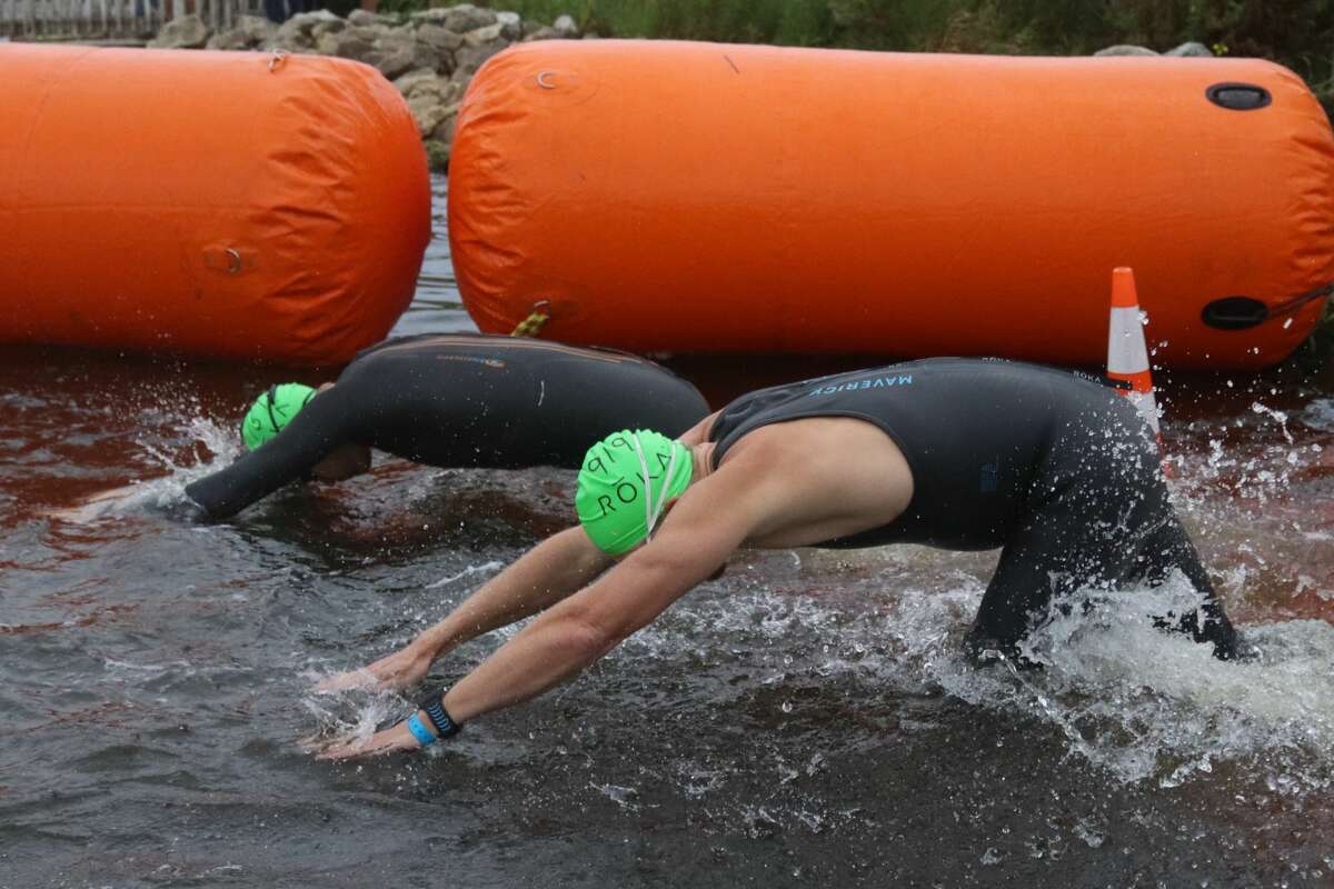 Racers get underway during the swimming portion of the triathlon during the IRONMAN 70.3 Michigan on Sept. 12 at Frankfort. 