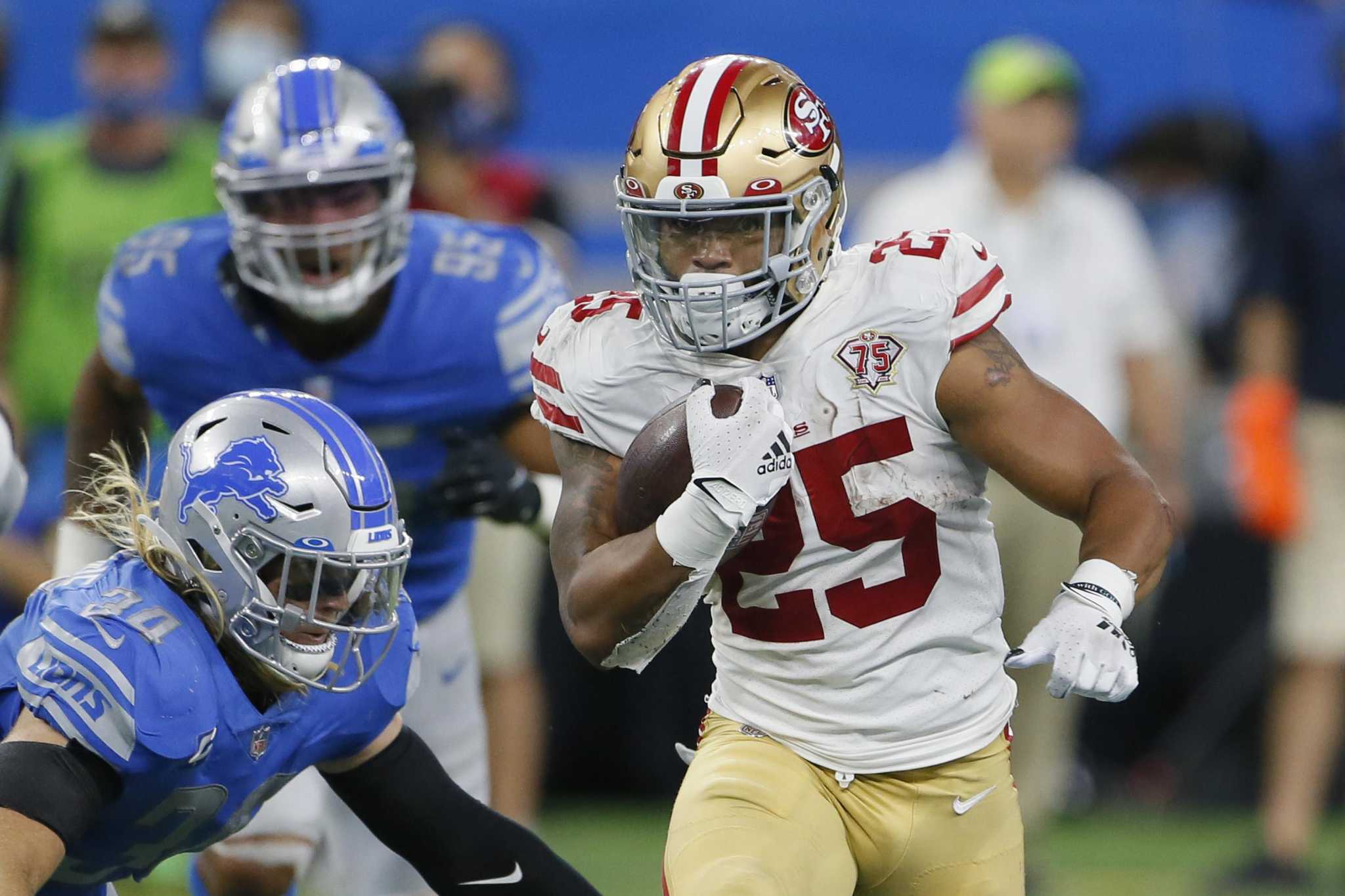 Eli Mitchell of the San Francisco 49ers plays against the Detroit