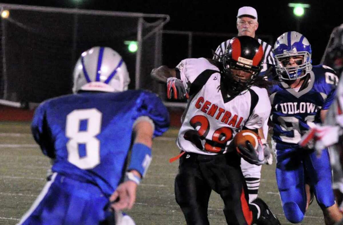 Bridgeport Central's Davin Campbell weaves in and out of Fairfield Ludlowe's defensemen Matt Fallon (8) and Mike Nagy (91) during the first quarter of Thursday's season opener football game against Fairfield Ludlowe at Ludlowe on Thursday, Sept. 16, 2010.