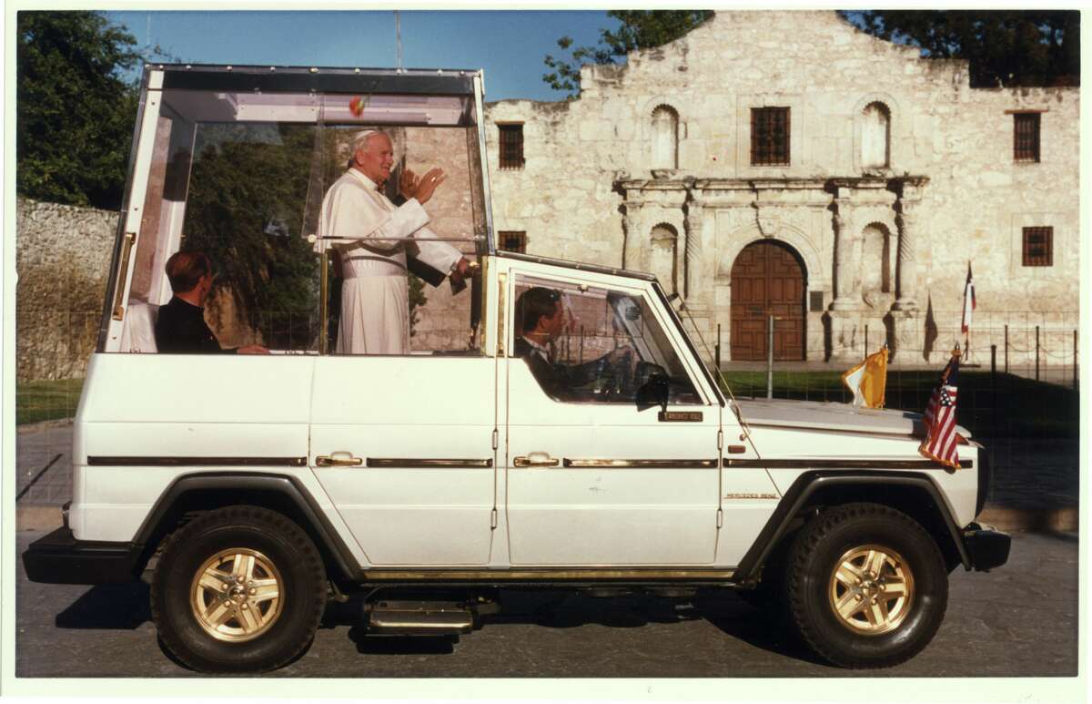 The pope passes in front of the Alamo in his `Popemobile' while visiting San Antonio in September, 1987. 
