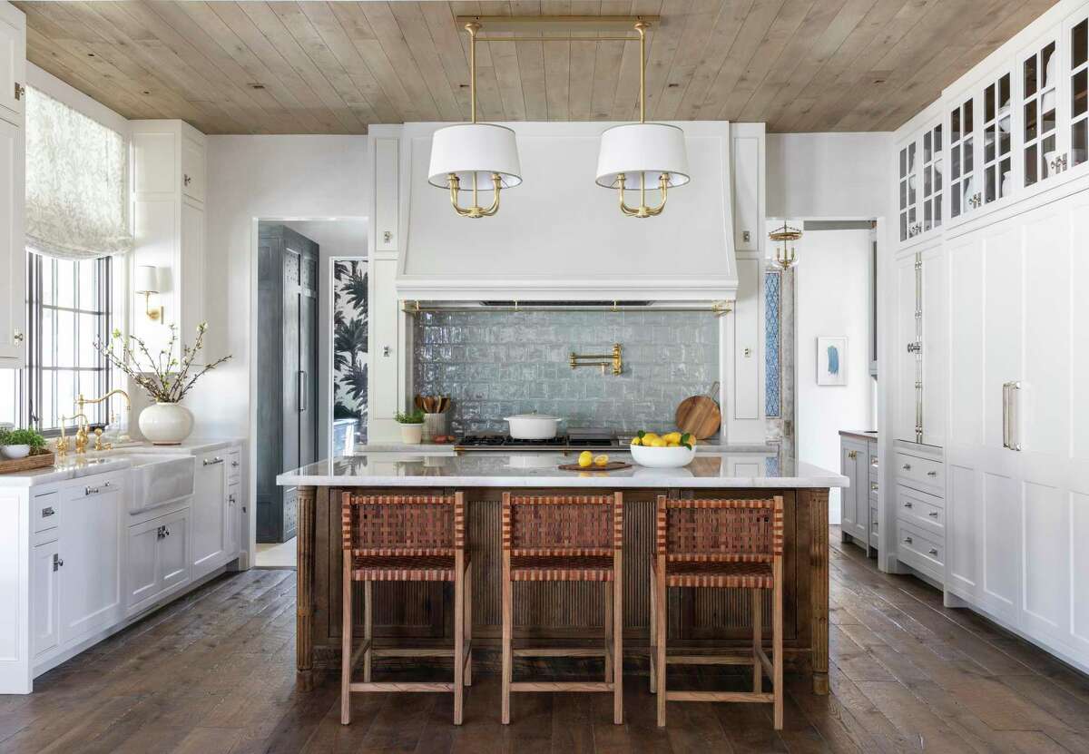 Both functional and pretty, this kitchen gives the Rices places to put everything, and style in every element, from the beautiful Lacanche range to quartzite counters.