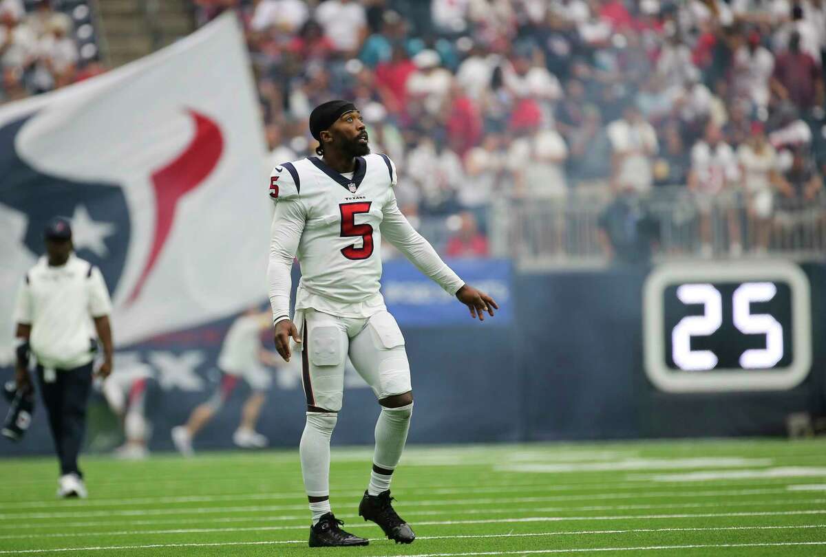 Houston Texans quarterback Tyrod Taylor (5) waits on the sideline to high-five teammates during the first half of an NFL football game against the Jacksonville Jaguars Sunday, Sept. 12, 2021, in Houston.