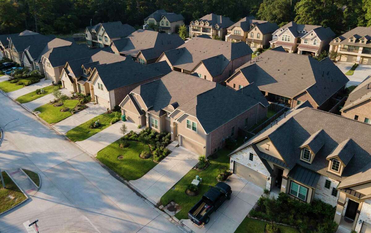 Townhomes in Grand Central Park are seen Friday, Sept. 10, 2021, in Conroe. Priced from the high $200s, Gehan’s new Grand Central Park 1,700-2,200 square-foot townhomes feature three-and four-bedroom plans with choice of first-floor or second-floor Owner’s Suite with walk-in closet, washer-dryer area and other builder options.