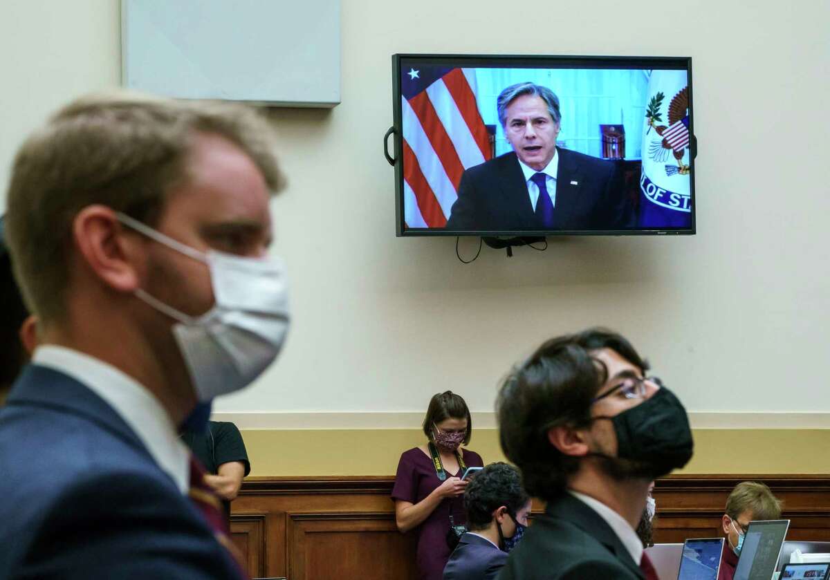 Secretary of State Antony Blinken appears remotely on a TV monitor to answer questions from the House Foreign Affairs Committee about the U.S. withdrawal from Afghanistan, at the Capitol in Washington, Monday, Sept. 13, 2021.