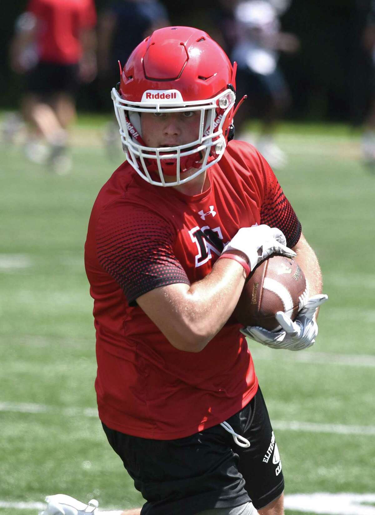 New Canaan's Vin Cognetta turns to run after a reception during day one of the Grip It and Rip It football tournament in New Canaan on Friday, July 9, 2021.