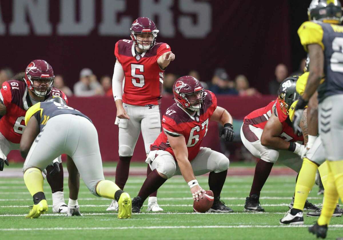 San Antonio quarterback Logan Woodside directs the offensive line as the Commanders host San Diego at the Alamodome in the opening game for the Alliance of American Football league on Feb. 9, 2019. The league folded after its eighth game. Two AAF players filed a class-action lawsuit against the now-defunct league and its backers for fraud and breach of contract.
