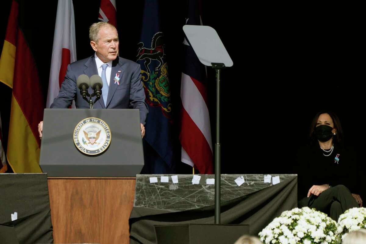 Former President George W. Bush speaks during a memorial for the passengers and crew of United Flight 93, Saturday Sept. 11, 2021, in Shanksville, Pa., on the 20th anniversary of the Sept. 11, 2001 attacks, as Vice President Kamala Harris looks on, right. (AP Photo/Jacquelyn Martin)