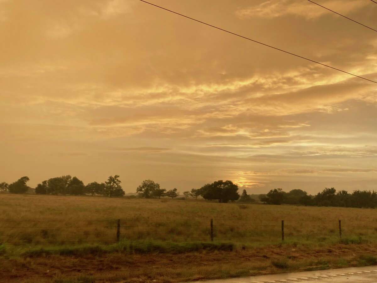 Photos show 'frightening' orange sky over Houston ahead of Tropical