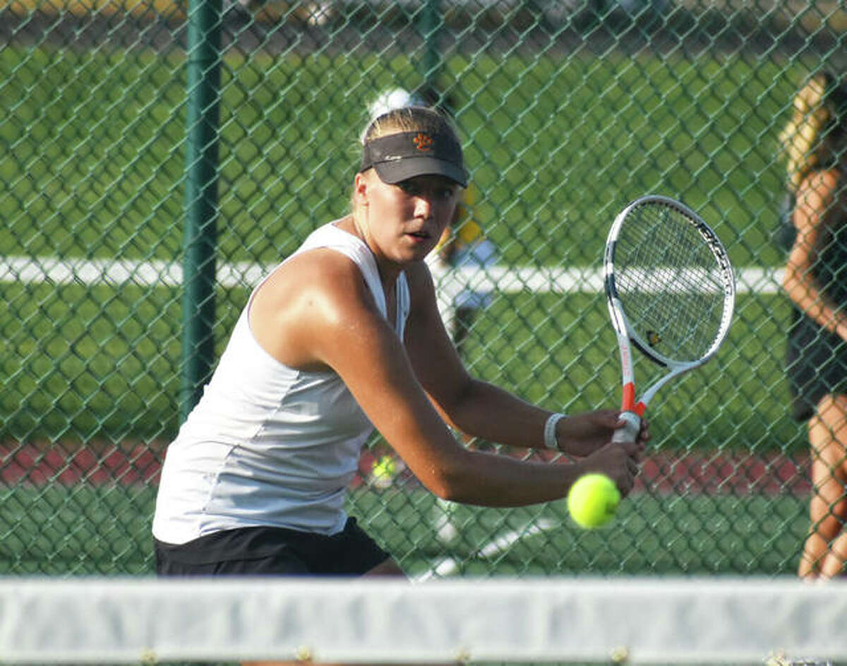 Edwardsville’s Hannah Colbert prepares to hit a return shot during a Southwestern Conference match against O’Fallon.