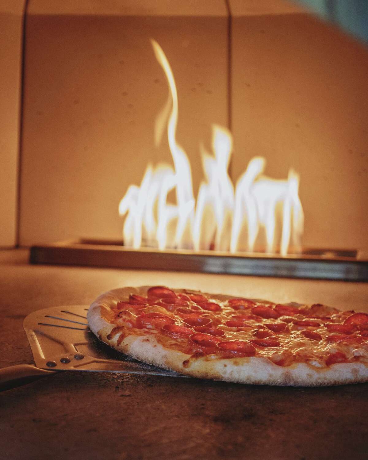 Rebel Dog's East Hartford location features brick-oven pizza.