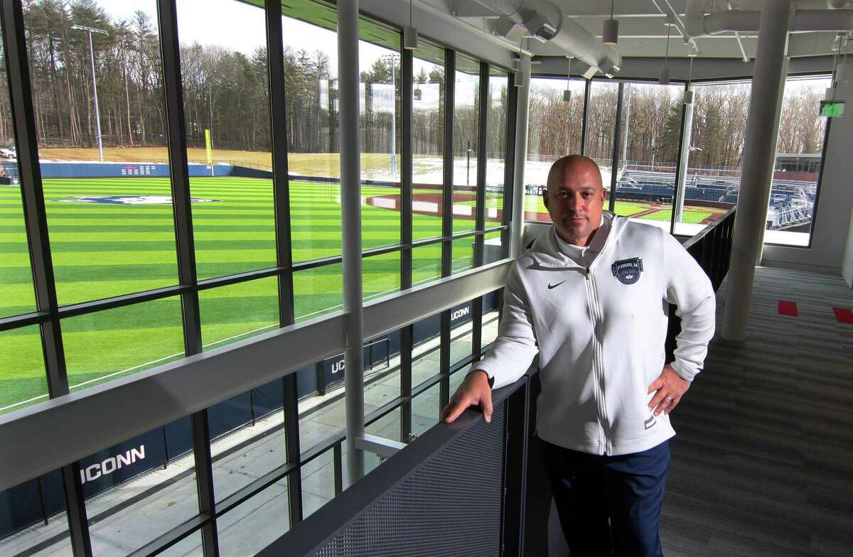 UConn Athletic Director David Benedict, poses inside the new Rizza Performance Center on the campus in Storrs, Conn., on Thursday Mar. 4, 2021. In the background is the Elliot Ballpark.