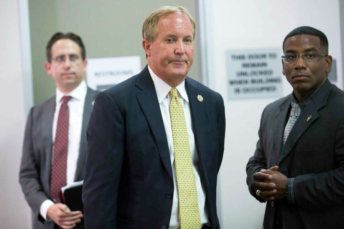 Texas Attorney General Ken Paxton arrives to a news conference at the Houston Recovery Center Thursday, Aug. 5, 2021 in Houston.