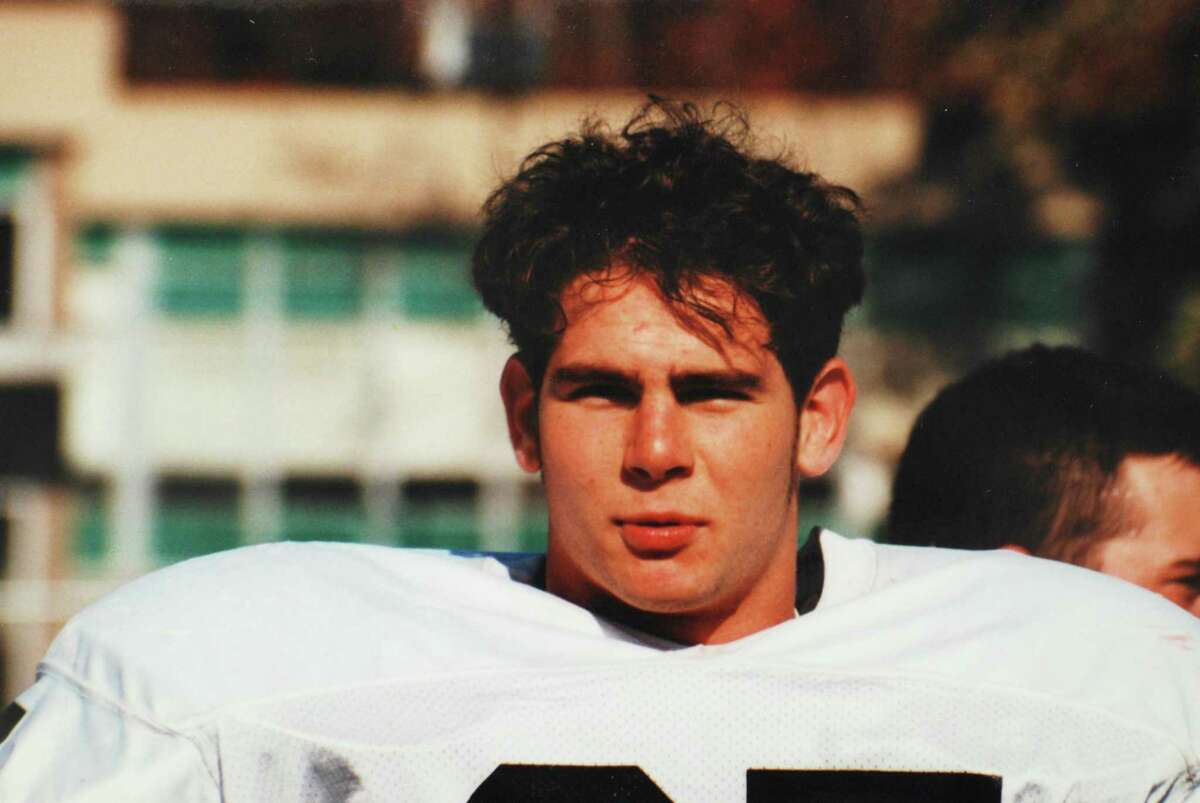 Brian Wilderman in his New Canaan High School football uniform. Wilderman, a captain of the Rams' 1997 team, died in 2000. New Canaan has renamed its first home game of the year the Brian Wilderman Game in his honor.