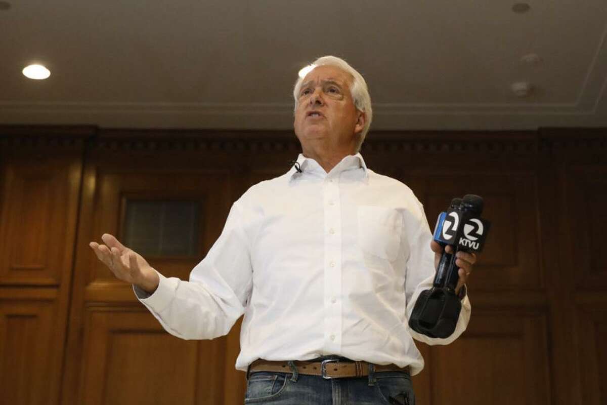 Republican recall candidate John Cox stands on a makeshift Monopoly board to represent high costs in California during a news conference at the Westin St. Francis in San Francisco on Aug. 10.