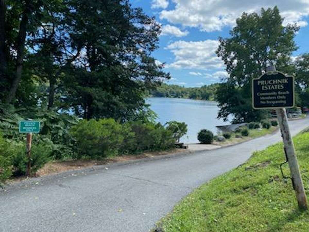 Candlewood Shore community beach in New Milford, Conn., where a Norwalk, Conn., father recently drowned in September 2021 after trying to help two children who were struggling while swimming.