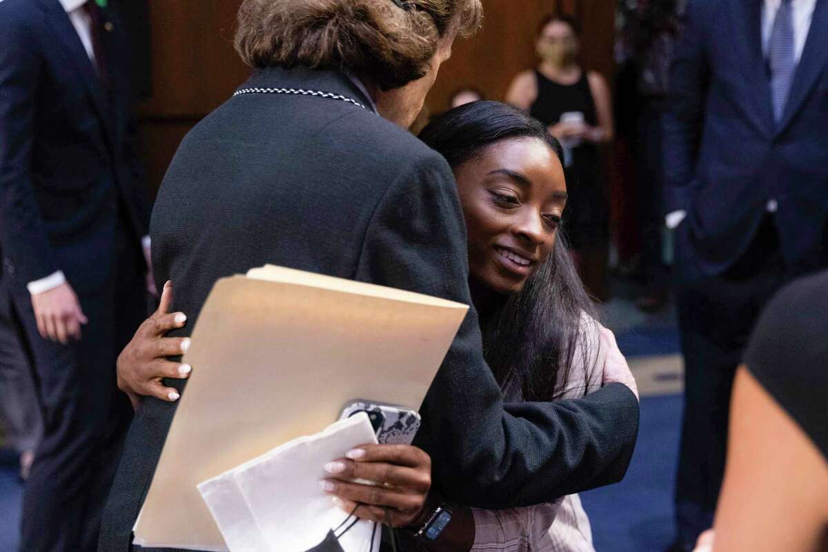 Sen. Diane Feinstein, D-Calif., hugs United States Olympic gymnast Simone Biles after a Senate Judiciary hearing about the Inspector General's report on the FBI's handling of the Larry Nassar investigation on Capitol Hill, Wednesday, Sept. 15, 2021, in Washington. Nassar was charged in 2016 with federal child pornography offenses and sexual abuse charges in Michigan. He is now serving decades in prison after hundreds of girls and women said he sexually abused them under the guise of medical treatment when he worked for Michigan State and Indiana-based USA Gymnastics, which trains Olympians. (Graeme Jennings/Pool via AP)