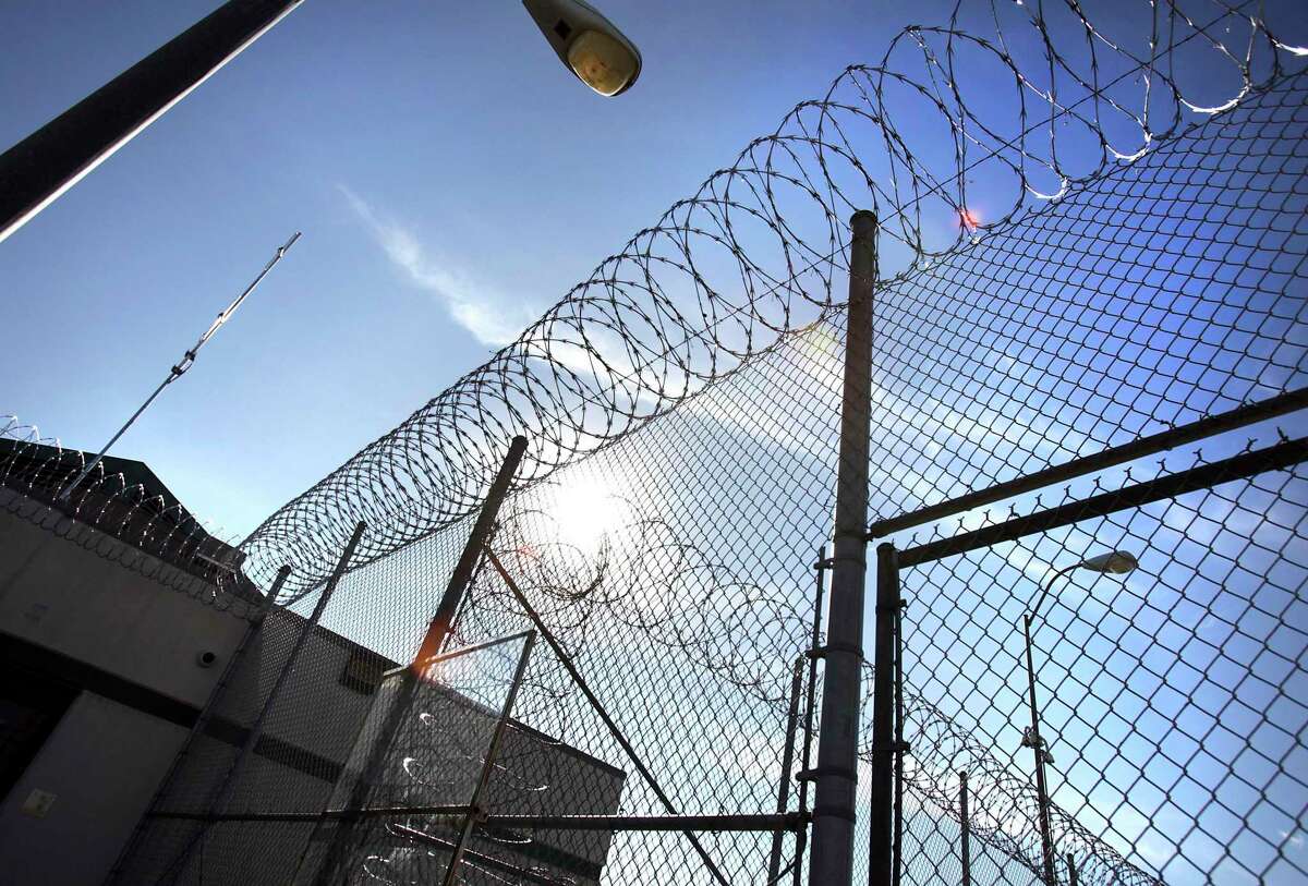 In this Jan. 5, 2012 photo, razor wire tops the fencing at the Polunsky Unit prison in Livingston, Texas. ( Bob Owen/Houston Chronicle )
