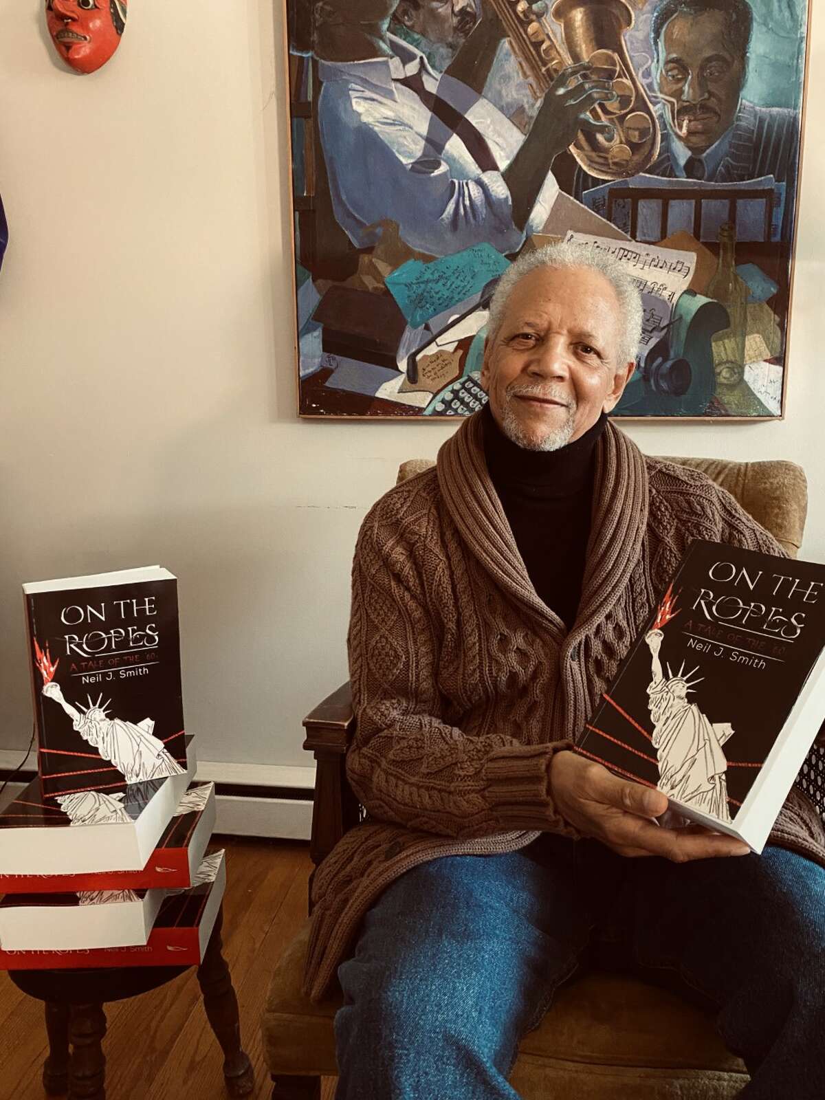 Author Neil J. Smith with his novel, “On the Ropes: A Tale of the ’60s.”