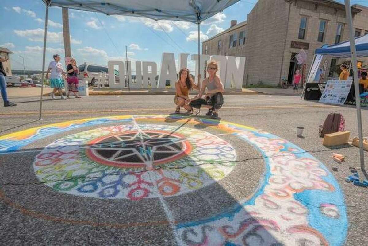 A large colorful mandala adorns East Broadway in Alton at a past Mississippi Earthtones Festival. Chalk artists will return this year to decorate the street with large colorful mandalas this Saturday during the 15th annual Mississippi Earthtones Festival from noon to 10 p.m.