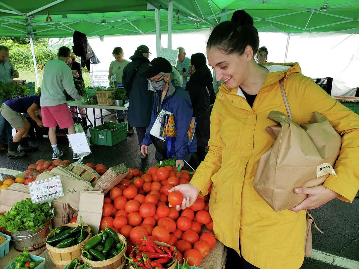 Caitlin McGowan, chef at The Art Space Cafe in Norwalk, shopping at the Westport Farmers market.