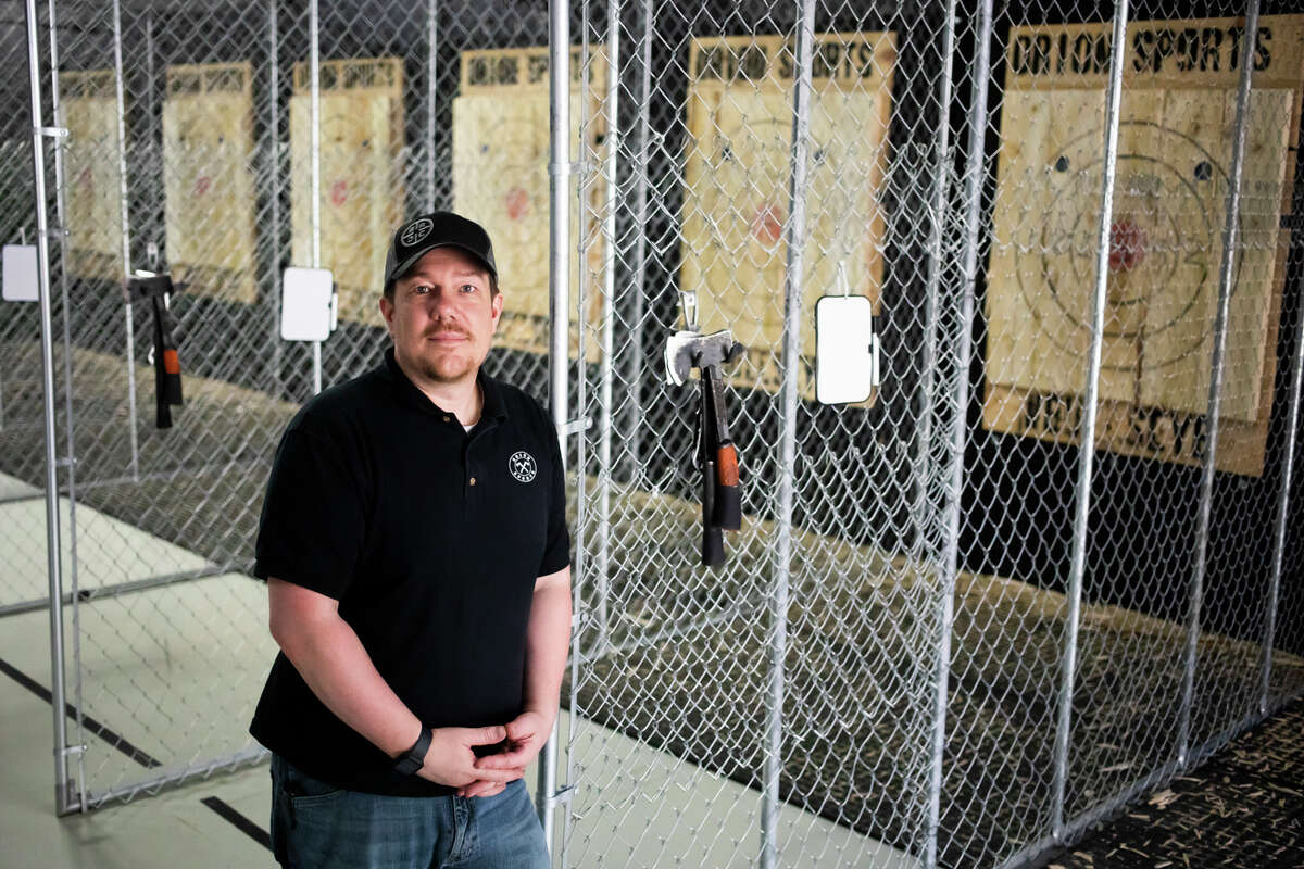 Orion Sports owner Duane Novak poses for a portrait Wednesday, Sept. 15, 2021 at the business, located inside the Midland Mall, which features axe throwing, arcade games and laser tag. (Katy Kildee/kkildee@mdn.net)
