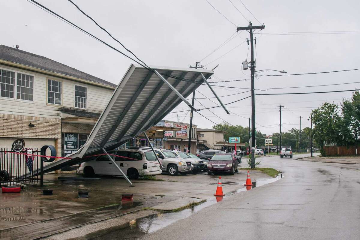 HOUSTON, TEXAS - SEPTEMBER 14: A carport hangs from power-lines after Tropical Storm Nicholas moved through the area on September 14, 2021 in Houston, Texas. Tropical Storm Nicholas strengthened to a Category 1 hurricane as it made landfall late Monday evening, but is gradually weakening as it moves towards the Northeast. Nicholas is projected to become a tropical depression by tomorrow. (Photo by Brandon Bell/Getty Images)