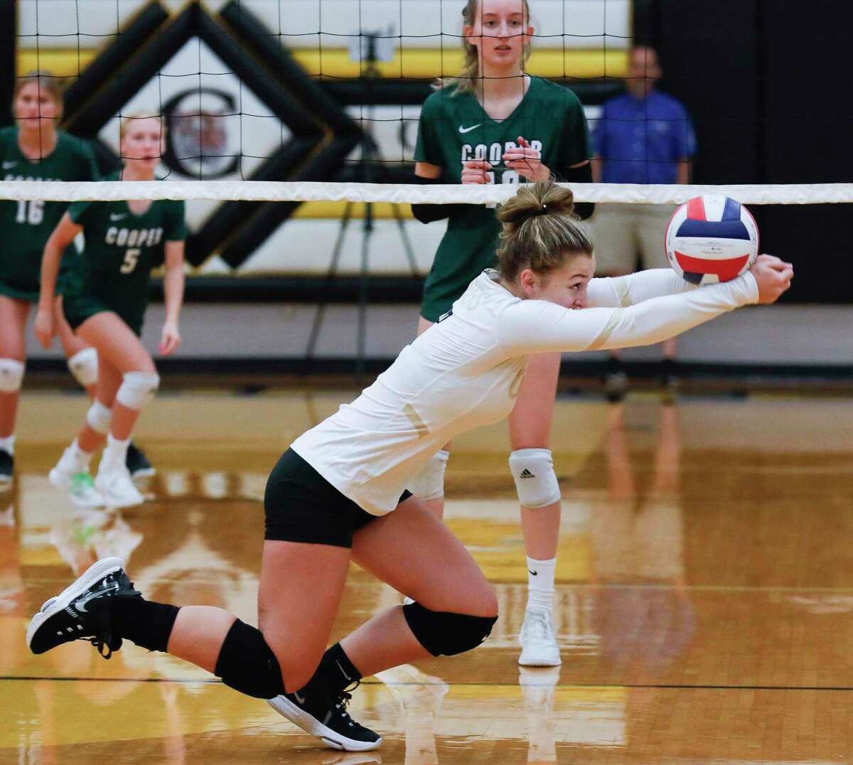 VOLLEYBALL: Young Conroe squad tames Dragons in four sets