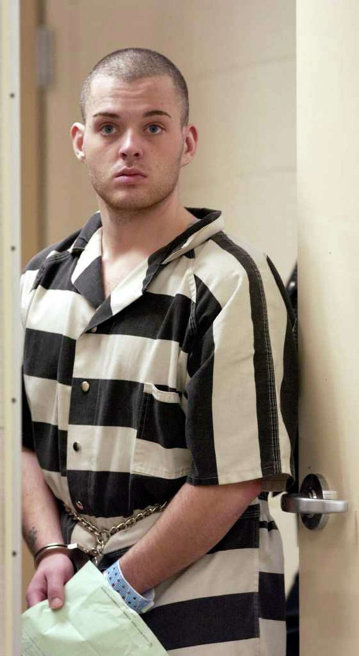 Christopher DiMeo, 23, is led into court in Mays Landing, N.J., Monday, Feb. 7, 2005. DiMeo, 23, a suspect in two fatal jewelry store robberies agreed to return to New York to face charges along with the girlfriend who allegedly was his accomplice. DiMeo, who was arraigned as a fugitive and sought for a parole violation, will be charged with murder in the Dec. 21 slaying of Renison, according to Detective Sgt. Herbert Daub of the Nassau County Police Department. (AP Photo/Mary Godleski)