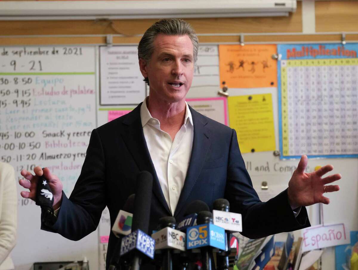 Gov. Gavin Newsom speaks to the press after visiting with students at Melrose Leadership Academy, a TK-8 school in Oakland, Calif., on Wednesday, Sept. 15, 2021.