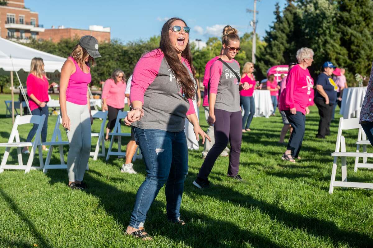 People dance during the Making Strides in Midland event hosted by Making Strides Great Lakes Bay at The H Hotel Wednesday, Sept. 15, 2021 in Midland. (Adam Ferman/for the Daily News)