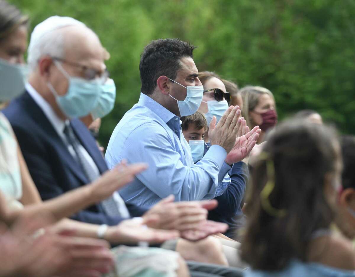 People sing during the Yom Kippur Family Service at the Greenwich Reform Synagogue in Greenwich, Connecticut on Thursday, September 16, 2021. Worshipers celebrated Yom Kippur, the Jewish Day of Atonement, with a variety of readings and songs.