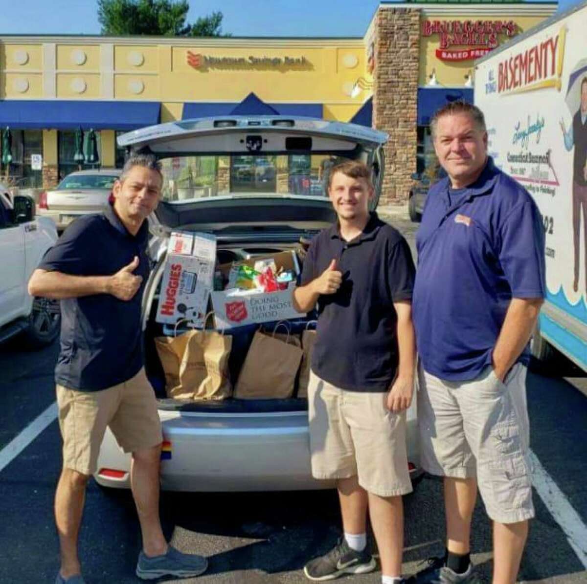 Envision Shelton Aldermen candidates David Gidwani, left, Matt McGee, center, and Chris Jones with donations - collected at a past donation drive - for the Shelton Animal Shelter. Gidwani is seeking reelection to the First Ward, while McGee and Jones are running in the Third Ward.