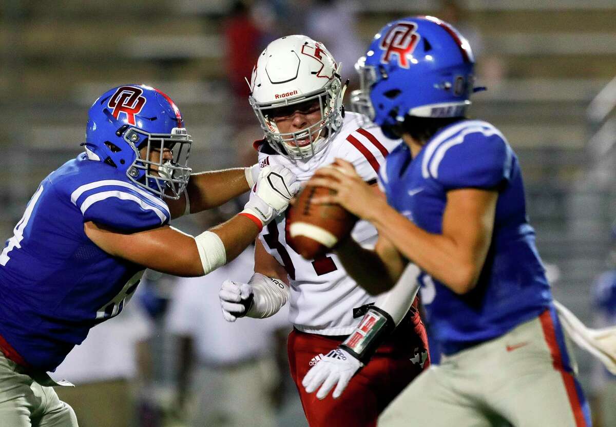 Tomball defensive linemen Travis Bates (34) pressures Oak Ridge quarterback Ethan Rodriguez (3) during the second quarter of a non-district high school football game at Woodforest Bank Stadium, Thursday, Sept. 16, 2021, in Shenandoah.