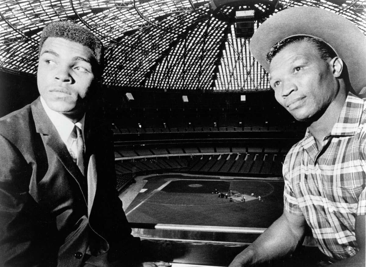 boxers Cassius Clay (aka Muhammad Ali) and Cleveland Williams at the Astrodome for official contract signing for fight, September 1966. The heavyweight title bout is to take place at the dome November 14, 1966.