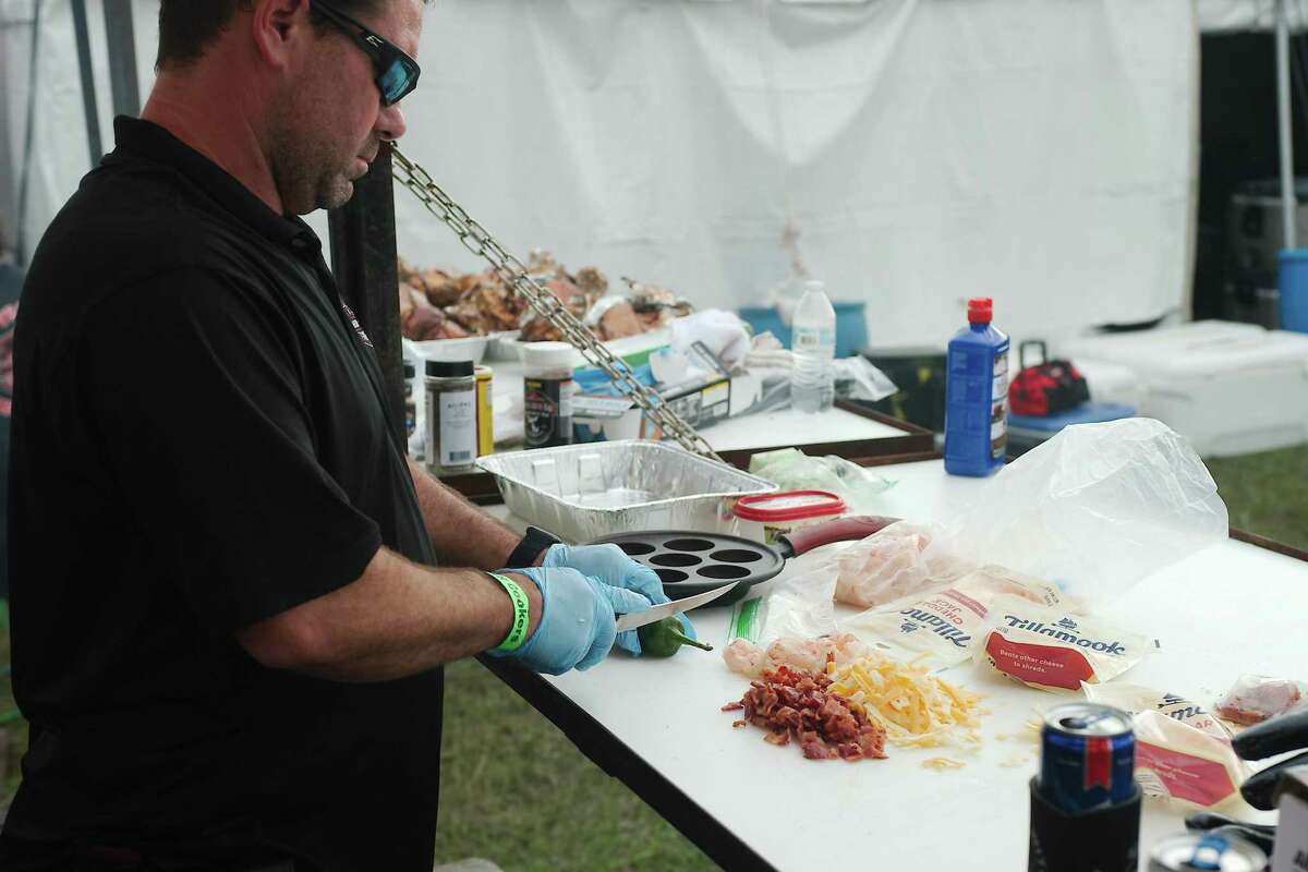 Richard Hanson of N-Flames cooking team prepares his signature Jacked Up Shrimp.