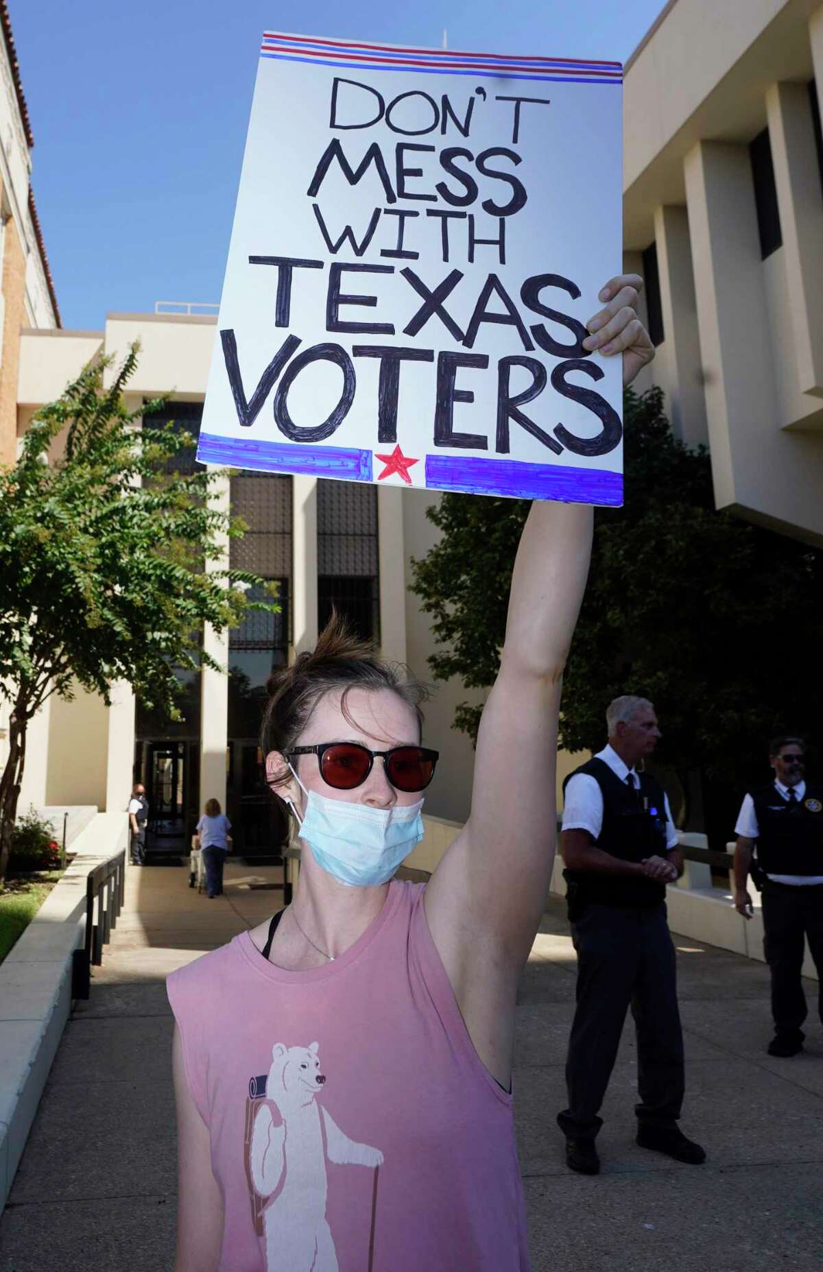 Texas has a long history of repeating itself by trying to suppress votes, control the border and exclude minorities from the political process. Here, a protester earlier this month responds to Gov. Greg Abbott signing SB 1, the elections bill.