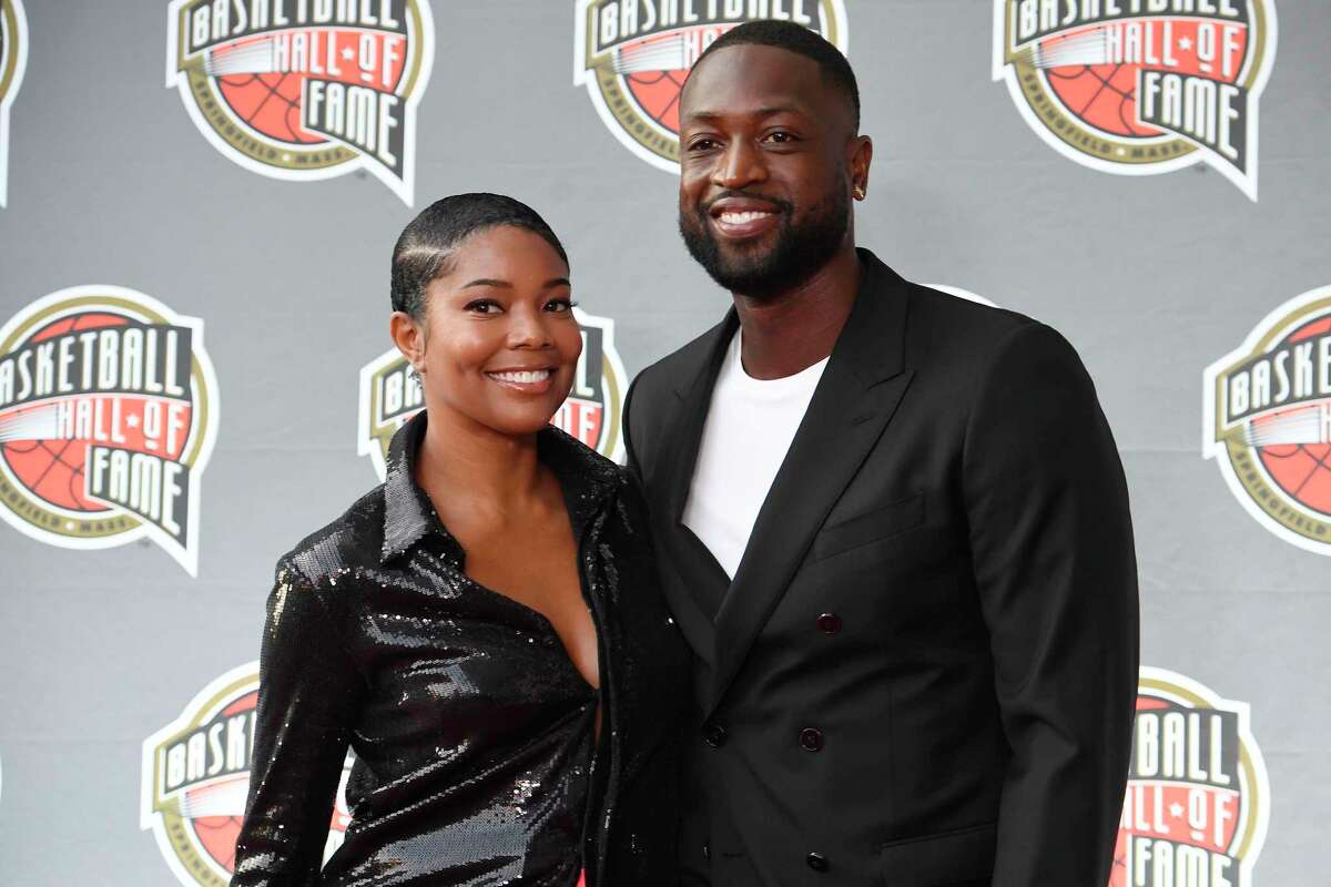 Gabrielle Union and Dwyane Wade pose for a photo on the red carpet for the 2021 Basketball Hall of Fame Enshrinement ceremony, Saturday, Sept. 11, 2021, in Springfield, Mass. (AP Photo/Jessica Hill)