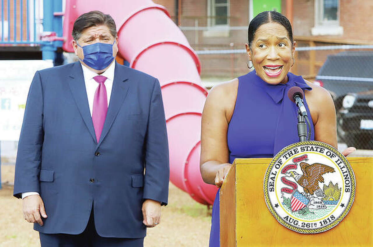 Illinois Lt. Gov. Juliana Strautton, right, talks Friday at an event with Gov. J.B. Pritzker, left, to tout “nation-leading childcare investments” by the state. The event was held on the playground of the Kreative Kids Learning Center in Alton.