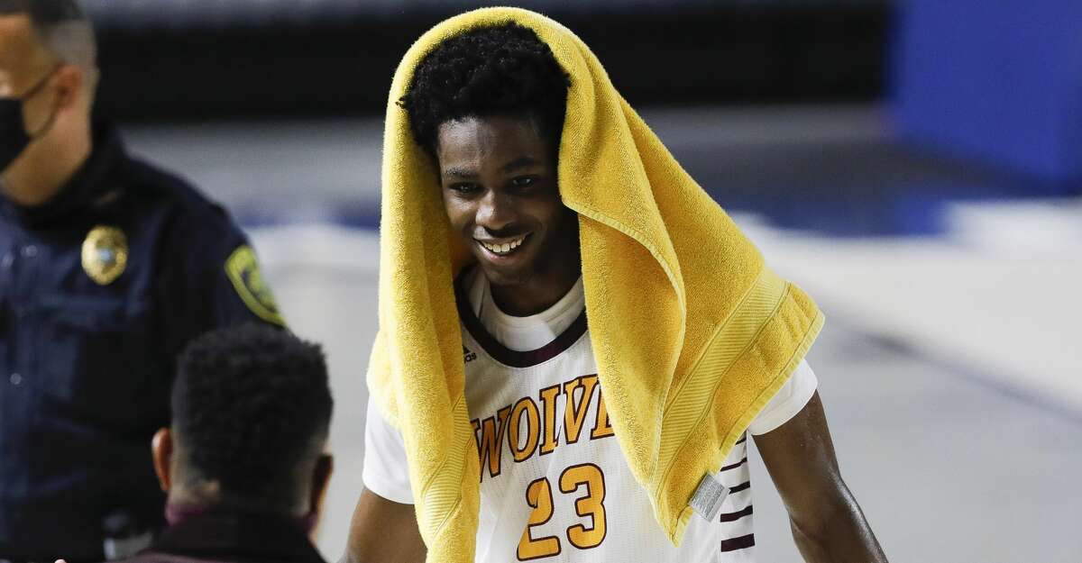 Beaumont United small forward Terrance Arceneaux (23) smiles after defeating Leander Glenn 82-57 during a Region III-5A state semifinal game at Delmar Fieldhouse, Tuesday, March 9, 2021, in Houston.
