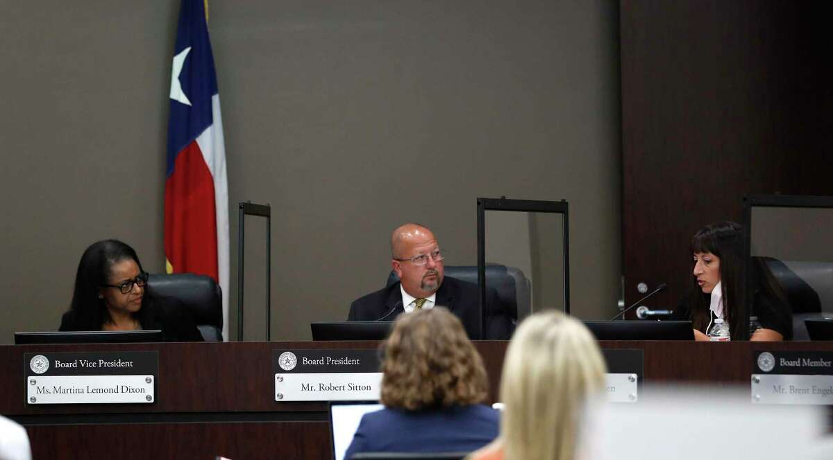 Humble ISD Board Vice President Martina Lemond Dixon asks a question of Superintendent Dr. Elizabeth Fagen, as board president Robert Sitton listens between them during the Humble ISD board meeting to discuss the reopening of schools, Monday, August 3, 2020, in Humble. This year, schools are open but short on substitutes. The board of trustees increased the pay for subsitutes to $120.